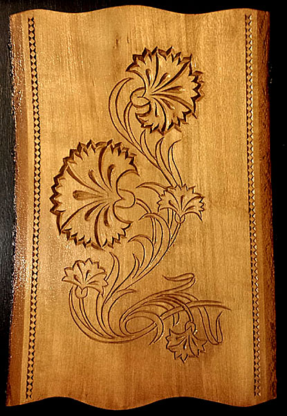 Hand carved carnation wall decoration